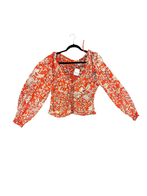 women's tops for those who want to wear versatile pieces that can be dressed up or downTop Long Sleeve By Free People In Orange, Size: L