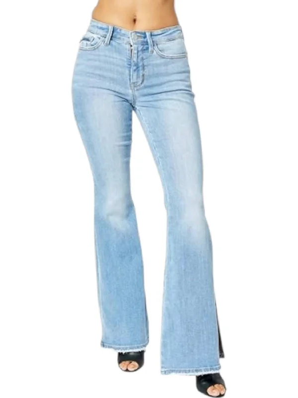 Mid Rise Raw Hem Slit Flare Jeans In Blue